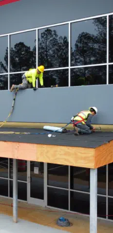 Construction Team Preparing Roof Covering for Awning